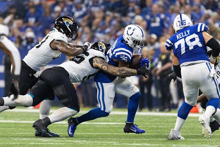 Sep 10, 2023; Indianapolis, Indiana, USA; Indianapolis Colts running back Deon Jackson (35) runs the ball while Jacksonville Jaguars linebacker Dequan Jackson (55) defends in the second half at Lucas Oil Stadium.